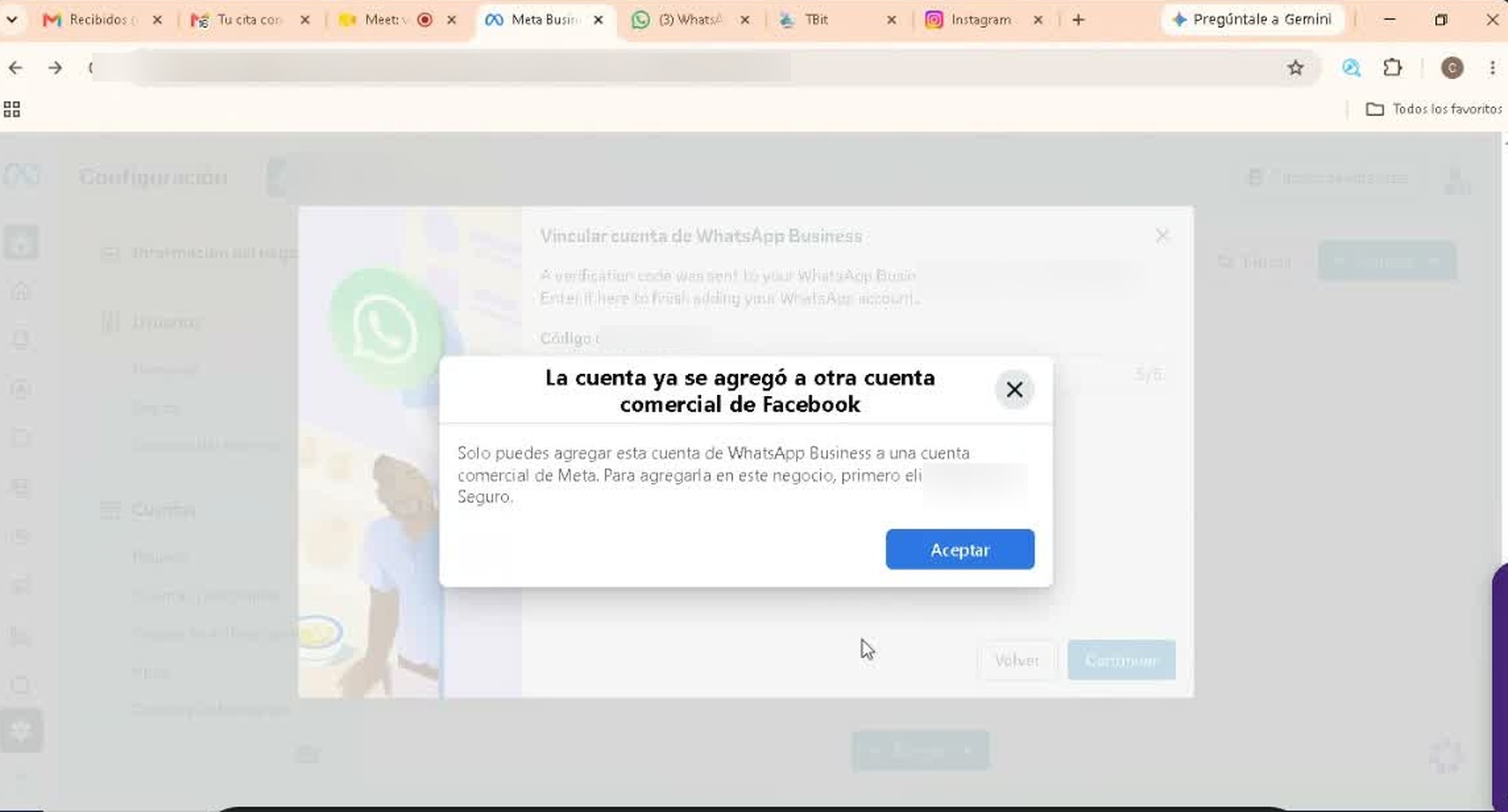 El aviso en pleno «Vincular cuenta de WhatsApp Business»: la cuenta ya vive en otro portafolio comercial.
